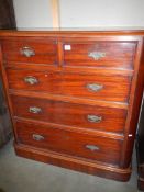 A Victorian mahogany two over three chest of drawers.