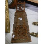 A carved Black Forest style adjustable book stand.