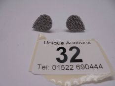 A pair of pear shaped white gold and diamond ear clips.