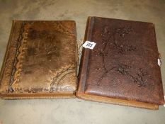 A Victorian musical photo album and another Victorian photo album.