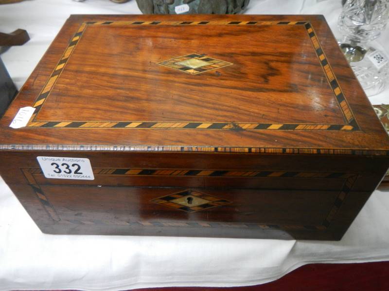 A mahogany inlaid box.