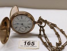 A gold plated full hunter pocket watch on brass chain by American Waltham Watch Co.,