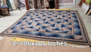 A blue & brown patterned carpet - 106 inches x 106 inches (COLLECT ONLY)