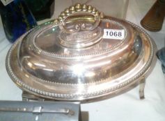A silver plated tureen on unusual stand.