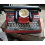 A boxed mettoy junior tinplate typewriter.