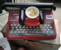 A boxed mettoy junior tinplate typewriter.