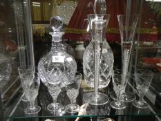 A mixed lot of cut glass including two decanters.