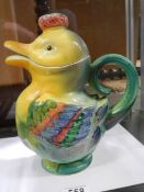 A nice ceramic jug in the shape of a duck.