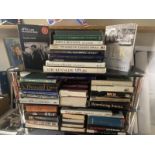 3 shelves of hardback books relating to JFK