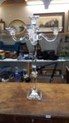 A tall heavy glass candelabra, height 80cm - 40cm x 40cm on top, base 15cm x 15cm COLLECT ONLY.