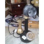 A vintage candlestick telephone