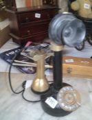 A vintage candlestick telephone