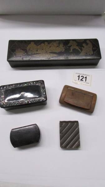 A Japanese lacquered brush box, a lacquer and mother of pearl pill box and three other boxes.