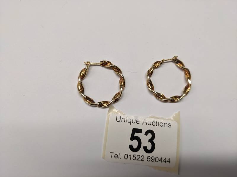 A pair of 9ct gold twisted design hoop earrings, 2.3 grams. - Image 3 of 4
