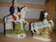 Two 19th century Staffordshire figures being Prince and a Zebra.