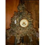 A Victorian cast iron 8 day clock with bronzed finish featuring horse, rider, dogs etc.,