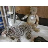 An old Teddy bear (in need of a little tlc) and a TY leopard.