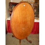 A Victorian mahogany oval tip top table. COLLECT ONLY.