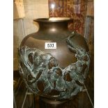 A 19th century heavy bronze urn featuring elephants.