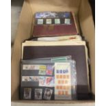 A collection of stamp albums, stamps & collectors packs etc.
