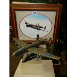 A model of a Lancaster bomber and a Lancaster print.