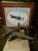 A model of a Lancaster bomber and a Lancaster print.