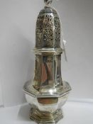 A hall marked silver sugar sifter.