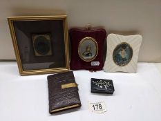 Two miniature portraits, a framed photograph, snuff box and prayer book.