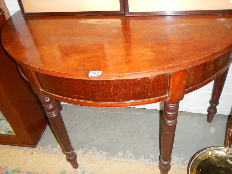 A mahogany D shaped hall table.