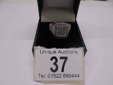 A 1 ct plus square shaped diamond ring, 6.9 grams. size L.