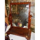 A Victorian mahogany toilet mirror.