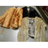 Three vintage fur jackets.