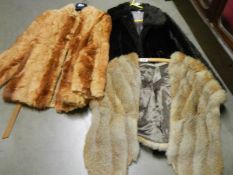 Three vintage fur jackets.