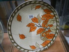 A Charlotte Rhead Crown Ducal tube line golden leaves wall plaque circa 1937, pattern 4921, 36 cm