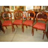 A set of four early 20th century mahogany dining chairs.