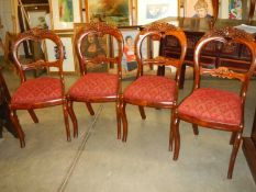 A set of four early 20th century mahogany dining chairs.