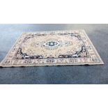 A beige coloured rug (COLLECT ONLY)