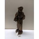 A carved wood figure of a boy, (30 cent hiwat).