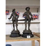 A pair of bronze cavalier figures.