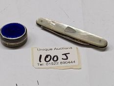 A silver and enamel pill box and a silver and mother of pearl pen knife.