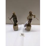 A pair of cold painted bronzes of a shepherdess and a tramp on marble bases, early 20th century. A/F