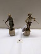 A pair of cold painted bronzes of a shepherdess and a tramp on marble bases, early 20th century. A/F