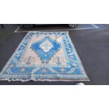 A blue patterned carpet - 303cm x 209cm (COLLECT ONLY)