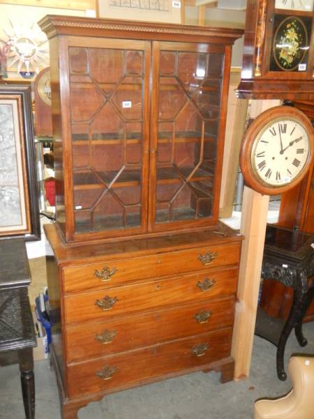 An astragal glazed bookcase on drawer base. COLLECT ONLY.