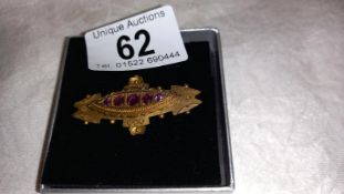 A 9ct gold brooch, Chester hall mark dated 1909, amethyst set.