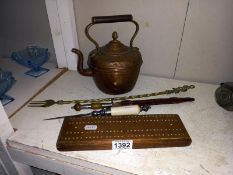 A copper kettle, 2 letter openers, a toasting fork & cribbage board