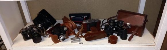 A quantity of camera's & pair of binoculars etc.