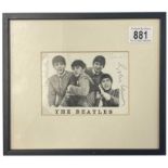 A signed photograph of The Beatles bearing the signatures of the band