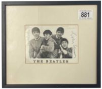 A signed photograph of The Beatles bearing the signatures of the band