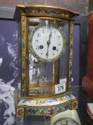 A brass and cloissonne' eight day mantel clock.